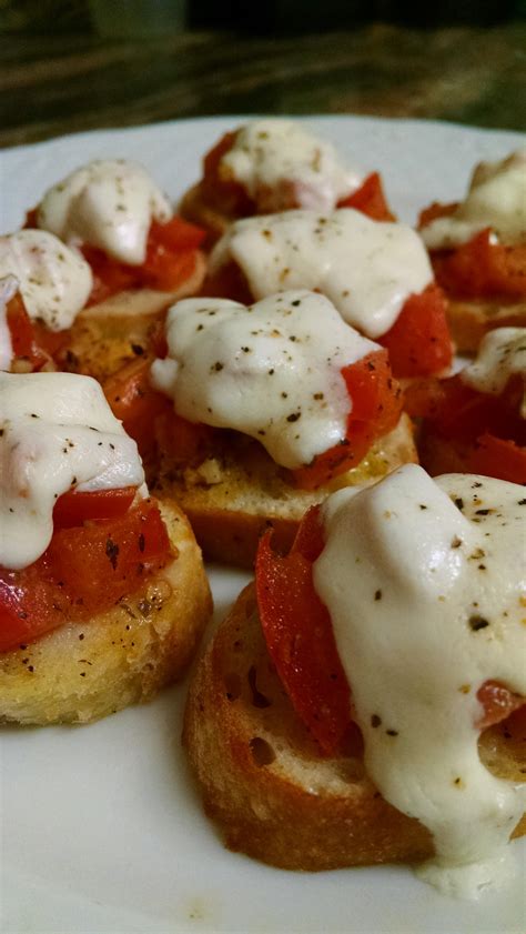 Homemade Bruschetta With Mozzarella And Finished With Fresh Cracked