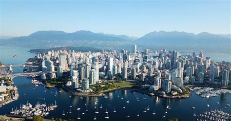 Aerial Overlooking Downtown And Vancouver Skyline With Ocean And