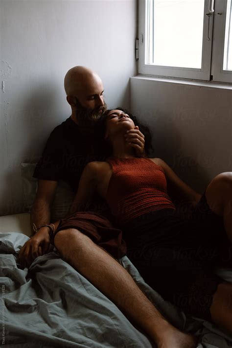 Ver Couple Caressing In Bed Del Colaborador De Stocksy Thais Varela
