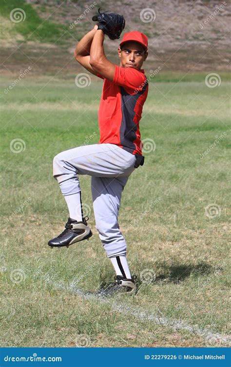 Baseball Pitcher Winds Up To Throw The Ball Royalty Free Stock Image