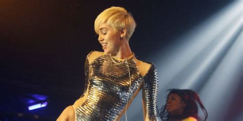 miley cyrus clutches blow up doll during x rated nearly naked performance at london s g a y pics