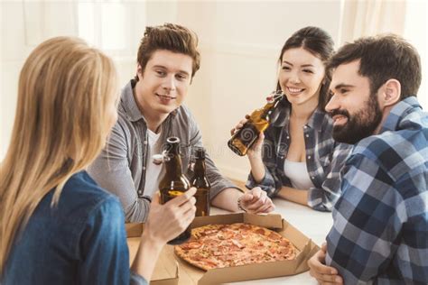 Couples Drinking Beer And Eating Pizza Stock Photo Image Of Beer
