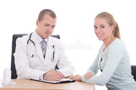 Young Doctor Explaining Diagnosis To Her Female Patient Stock Image