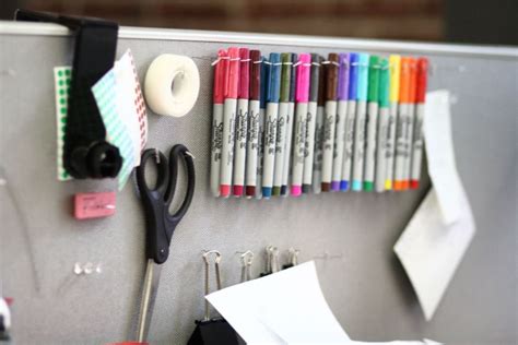 The first step in having a cute cubicle is cleaning it up — and that means you need an organization system. DIY Cubicle Organization