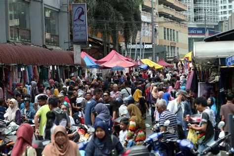 Bamboo 'chicks' giving shade to a shop selling indian made lunghis (sarongs). Last minute shopping at Jalan TAR | New Straits Times ...