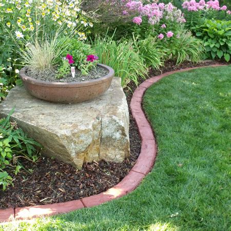 Pour concrete landscape curb once the forms were in place, i back filled some dirt around the outsides to help support the forms so that when i poured the concrete, they wouldn't bow out. HOME DZINE Garden Ideas | DIY Concrete Edging