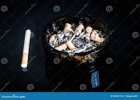 Overhead Of Burning Cigarette In Ashtray Stock Photo Image Of Ashtray