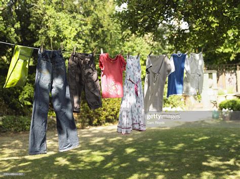 Clothes Hanging On Washing Line Hung Across Garden High Res Stock Photo