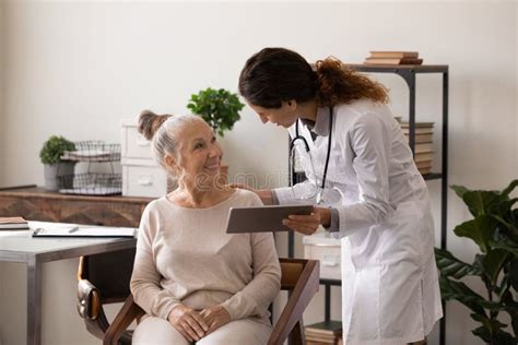 Female Doctor Consult Old Male Patient In Hospital Stock Photo Image