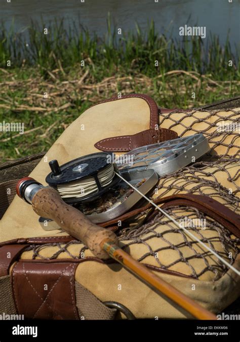 Traditional Old Vintage Fly Fishing Tackle With The River In The