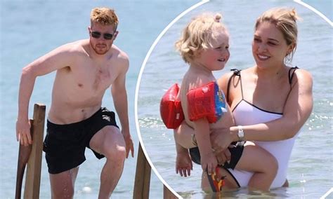 kevin de bruyne goes shirtless while his wife michele lacroix shows off her figure in a swimsuit