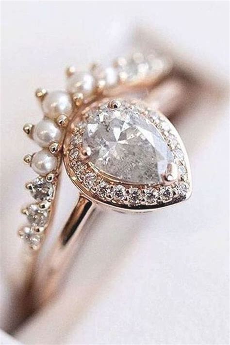 Rose Gold Tear Drop Diamond Wedding Ring Paired With A Pearl Wedding Band Perfection