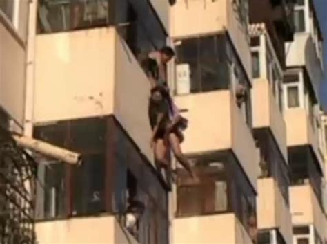 Lovers Tiff Leaves Couple Dangling From Balcony In China The Independent The Independent