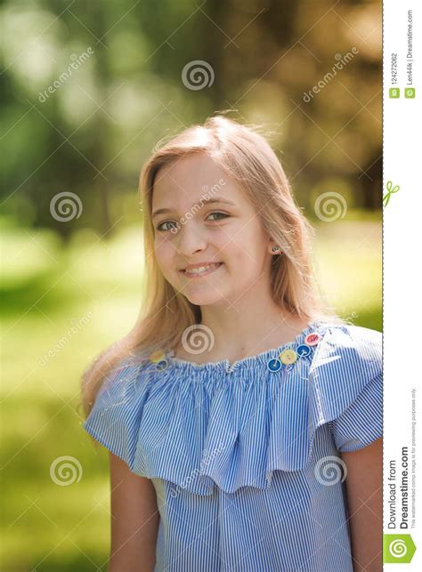 Portrait Of A Beautiful Young Girl In The Park Stock Photo Image Of