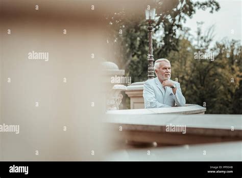 Thoughtful Mature Male Person Standing On Balcony Stock Photo Alamy