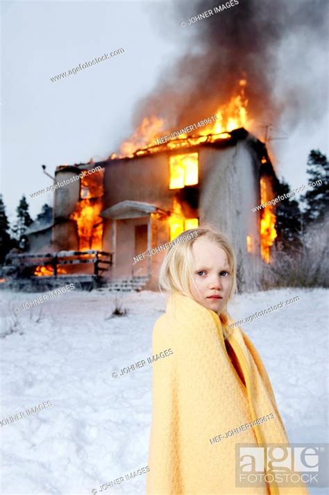 Rescued Girl In Front Of Burning House Stock Photo Picture And