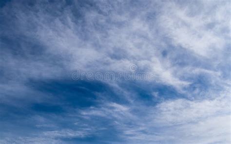 Beautiful Cirrus Cloud Formations In A Deep Blue Sky Stock Photo