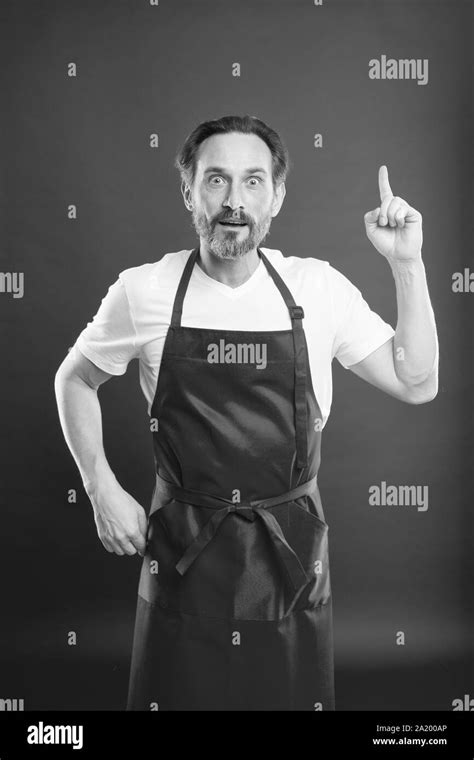 Something New Cook With Beard And Mustache Wearing Apron Red Background Man Mature Cook Posing
