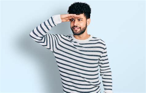 Young Arab Man With Beard Wearing Casual Striped Sweater Very Happy And
