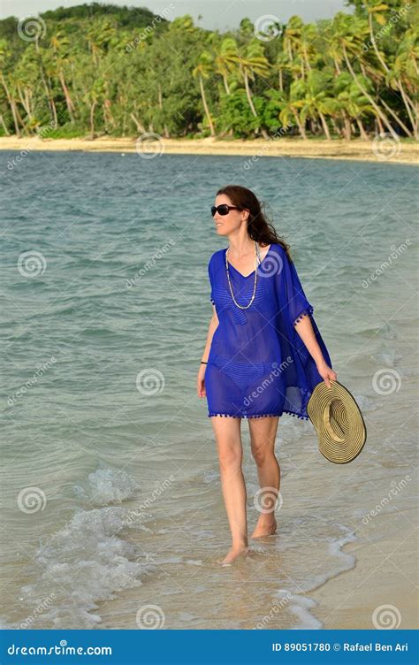 Tourist Woman Walks Along A Tropical Beach In Fiji Stock Photo Image