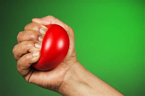Hand Squeezing Red Stress Ball Photograph By Vishwanath Bhat Fine Art