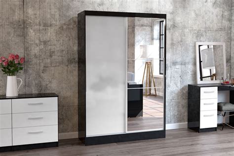 Create a bold statement with minimalist sliding mirror doors with framed glass panels, or choose a more classic and structured shaker style. Lynx 2 Door Sliding Wardrobe with Mirror | Crendon Beds ...