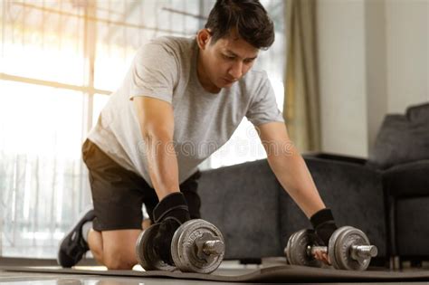 Sport Man Prepare Doing Dumbbell Exercise Workout In Home Stock Photo