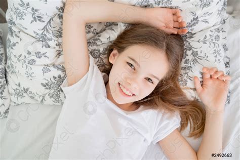 Teen Girl Lying In Bed Idle In Quarantine Stock Photo Crushpixel