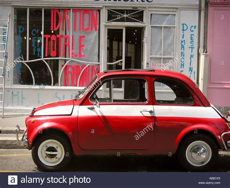 Red Fiat 500 Parked By Roadside At Quai De Valmy 10th Arr Paris Stock