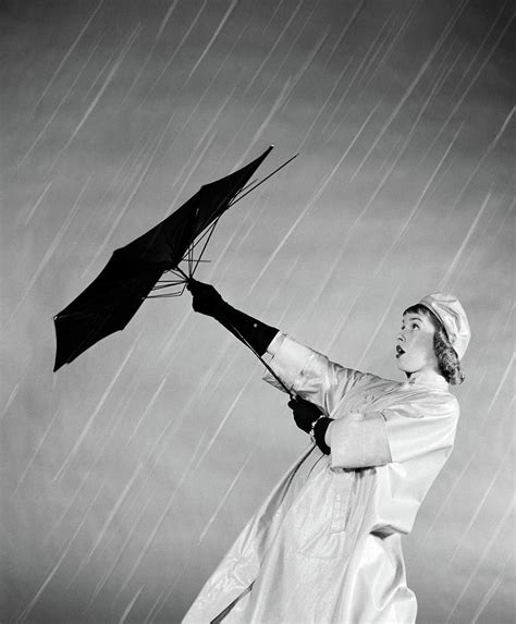 S Woman In Rain Coat Trying To Use Photograph By Vintage Images