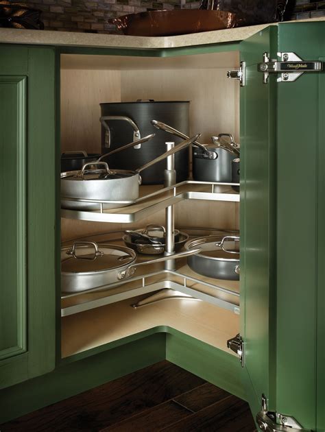 An Open Cabinet With Pots And Pans In It
