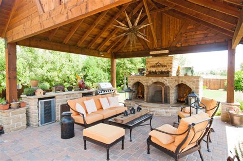 Outdoor Entertainment Area With Fireplace And Covering Covered Patio