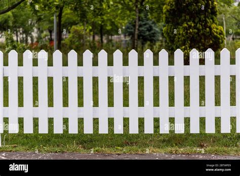 Wooden White Fences Around The Garden Stock Photo Alamy