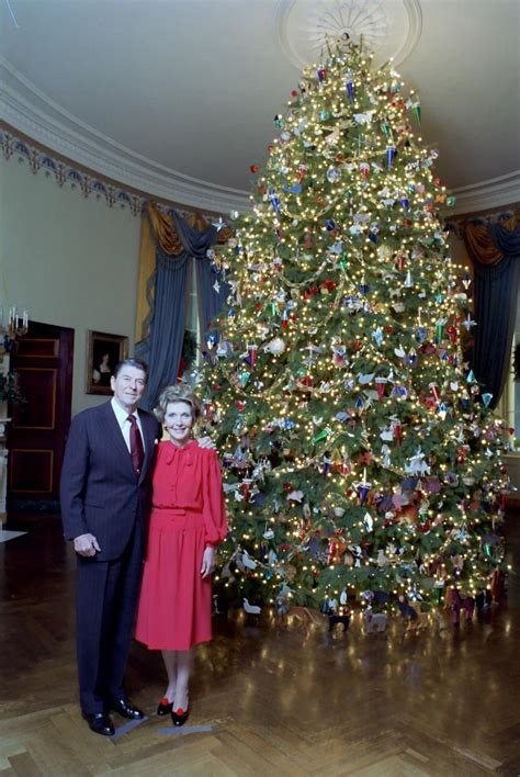 President Ronald Reagan And Nancy Reagan Portrait With The White House Christmas Tree In Blue