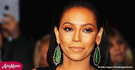 mel b 42 bares all as she suffers a wardrobe malfunction while wearing a tiny purple bikini