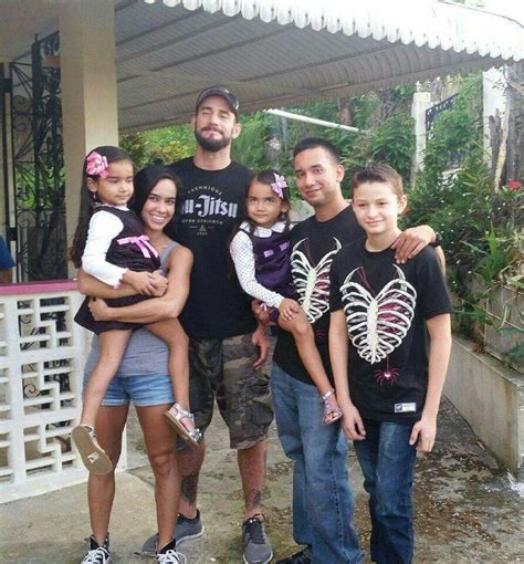 wwe diva aj lee april mendez brooks and her husband cm punk phil brooks with members of her