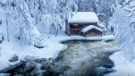 Cabin On Winter River By Jari Ehrström