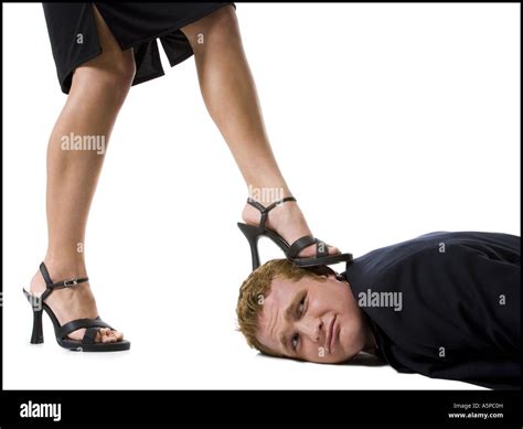 Woman Stepping On Mans Face