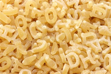 Alphabet pasta, also referred to as alfabeto and alphabetti spaghetti in the uk, is a pasta that has been mechanically cut or pressed into the letters of . Pasta Noodles In Alphabet Shapes Stock Image - Image of ...