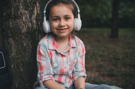 Close Up Caucasian Happy Little Child Girl Wearing Wireless Headphones