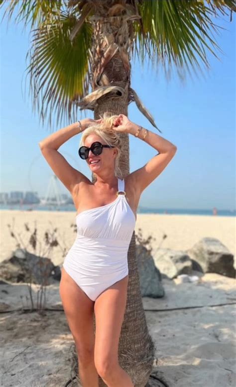 Denise Van Outen Shows Off Toned Physique In Tiny White Swimsuit