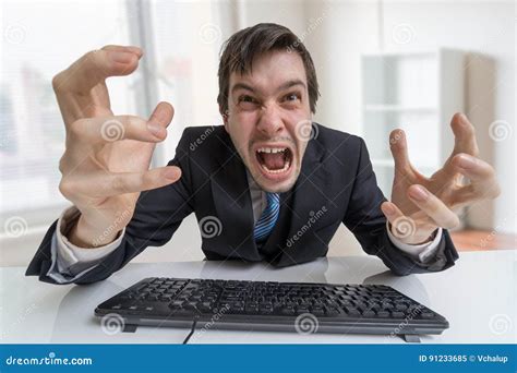 Frustrated Angry Businessman Is Shouting And Working With Computer In