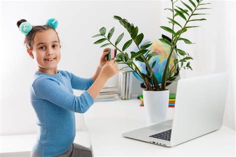 Premium Photo Little Girl Studying Nerd On Laptop Online