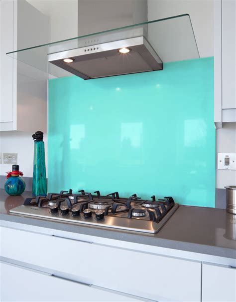 Backsplash panels allow you to bring a fun design element to your space while also protecting walls from grease splatter and other cooking stains. Aqua Glass Hob Splashback | Glass cooker splashback, Glass ...