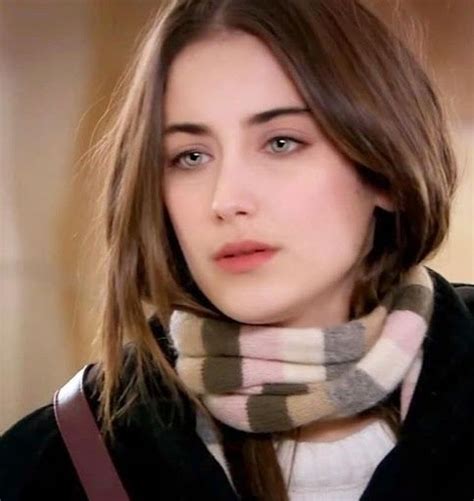 A Close Up Of A Person Wearing A Scarf