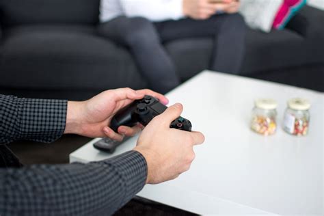 Person Holding Black Dualshock4 Controller · Free Stock Photo