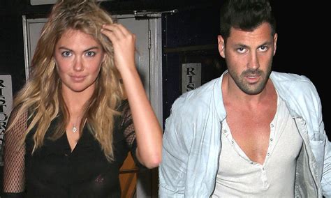kate upton and maksim chmerkovskiy on romantic dinner date and his top is more low cut than