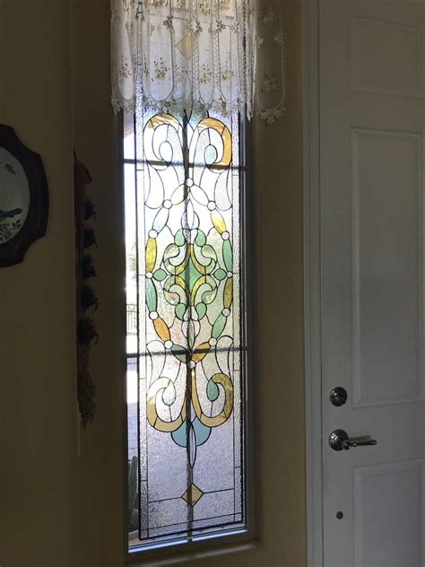 Victorian Stained Glass Window Set Against Existing Window With Grid