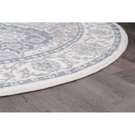 The primary color is terracotta. Nessa Ivory Oriental 7'10'' Round Rug - Pier1