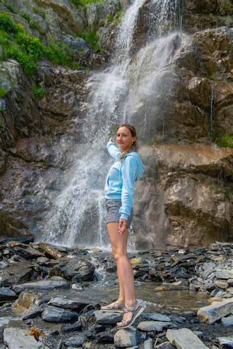 One Girl In Naked Clothes Stands At The Waterfall Stock Image Image